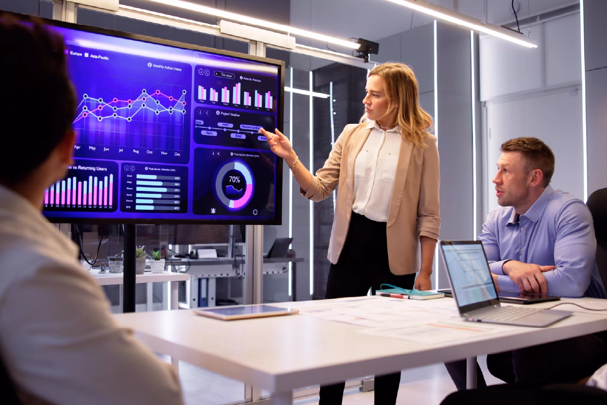 Private equity Professional explaining data figures on screen