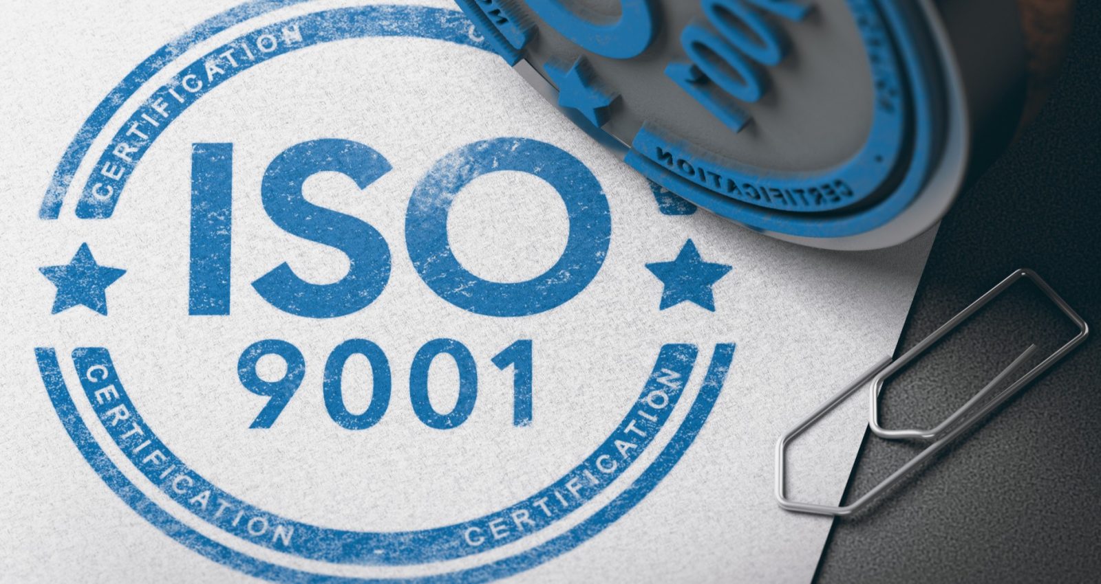 8066fd828230-3d-illustration-of-a-rubber-stamp-with-the-text-iso-9001-certification-over-paper-background