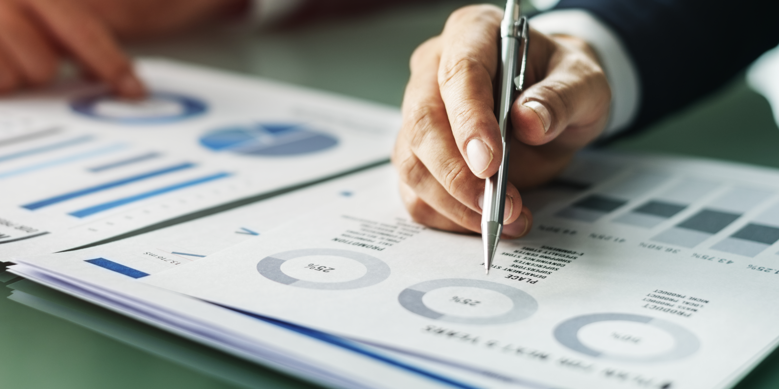 hands-writing-business-documents-desk-concept