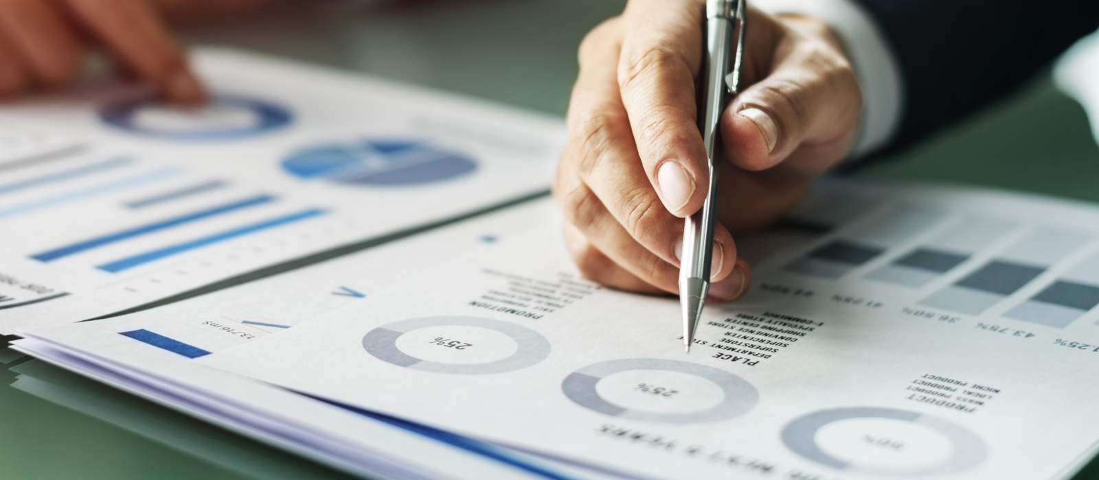 hands-writing-business-documents-desk-concept