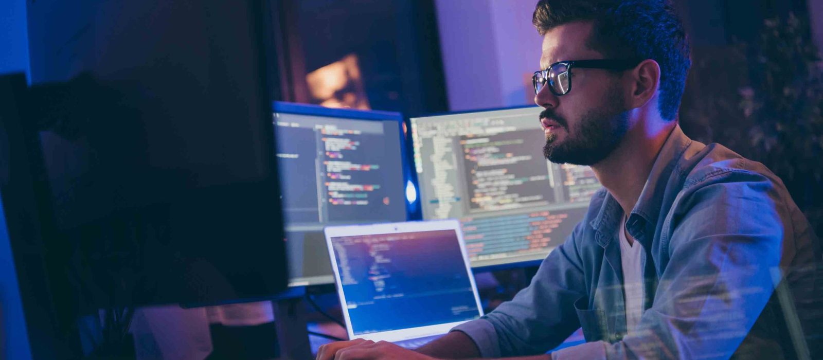Profile side view portrait of his he nice attractive skilled focused serious, guy writing script ai tech support devops creating digital solution front-end in dark room workplace station indoors