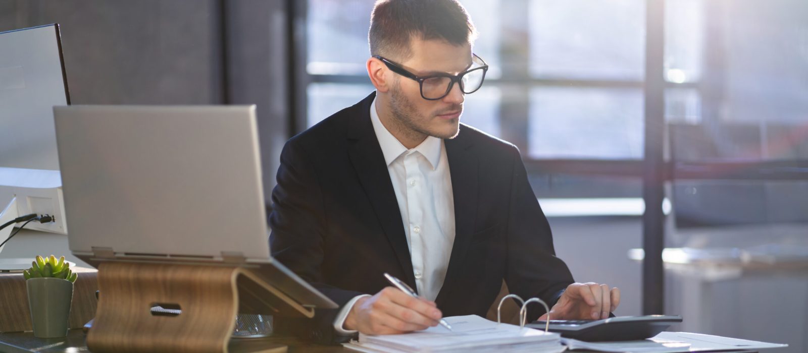 Professional Financial Accountant Manager Using Laptop For Taxes And Audit